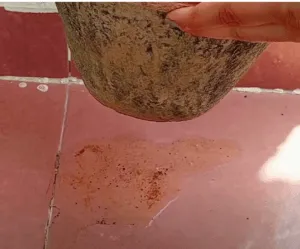 water flows out from the bottom hole